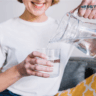 women water pouring in glass