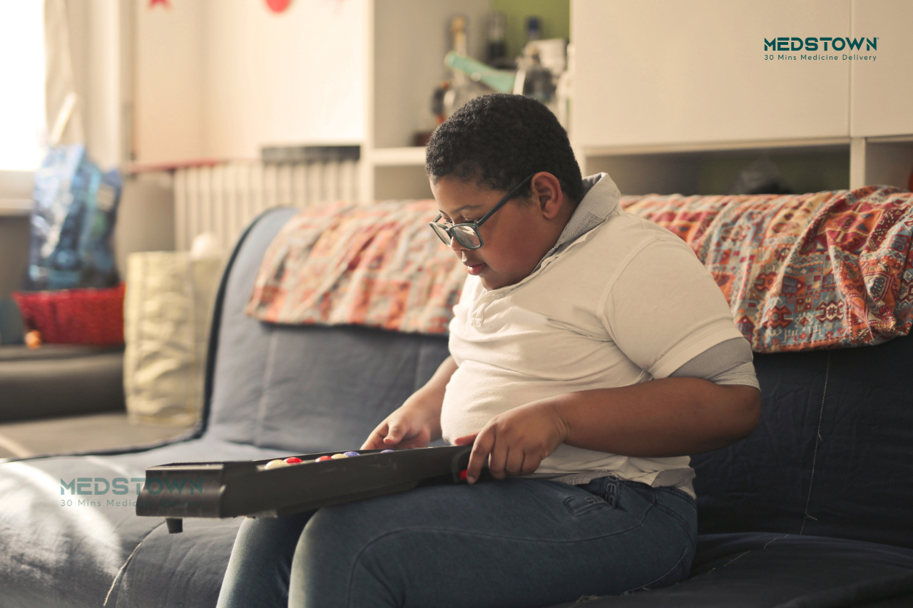 Young boy suffering with obsity