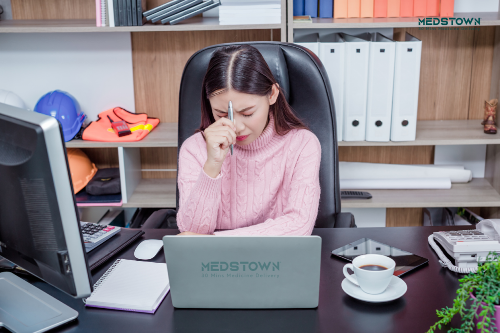 Person sitting at a desk, working.