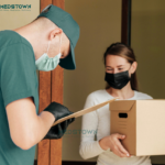 Delivery person handing over a package.