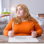 Person choosing between salad and cake.