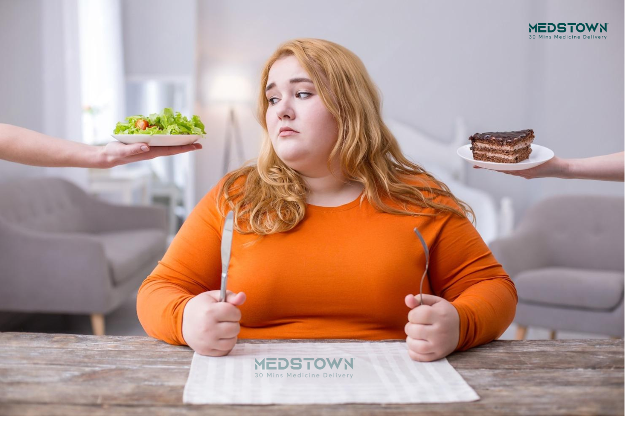 Person choosing between salad and cake.