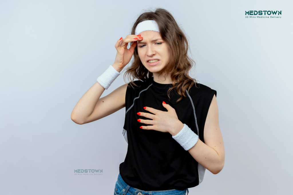 Person in sports attire posing playfully.